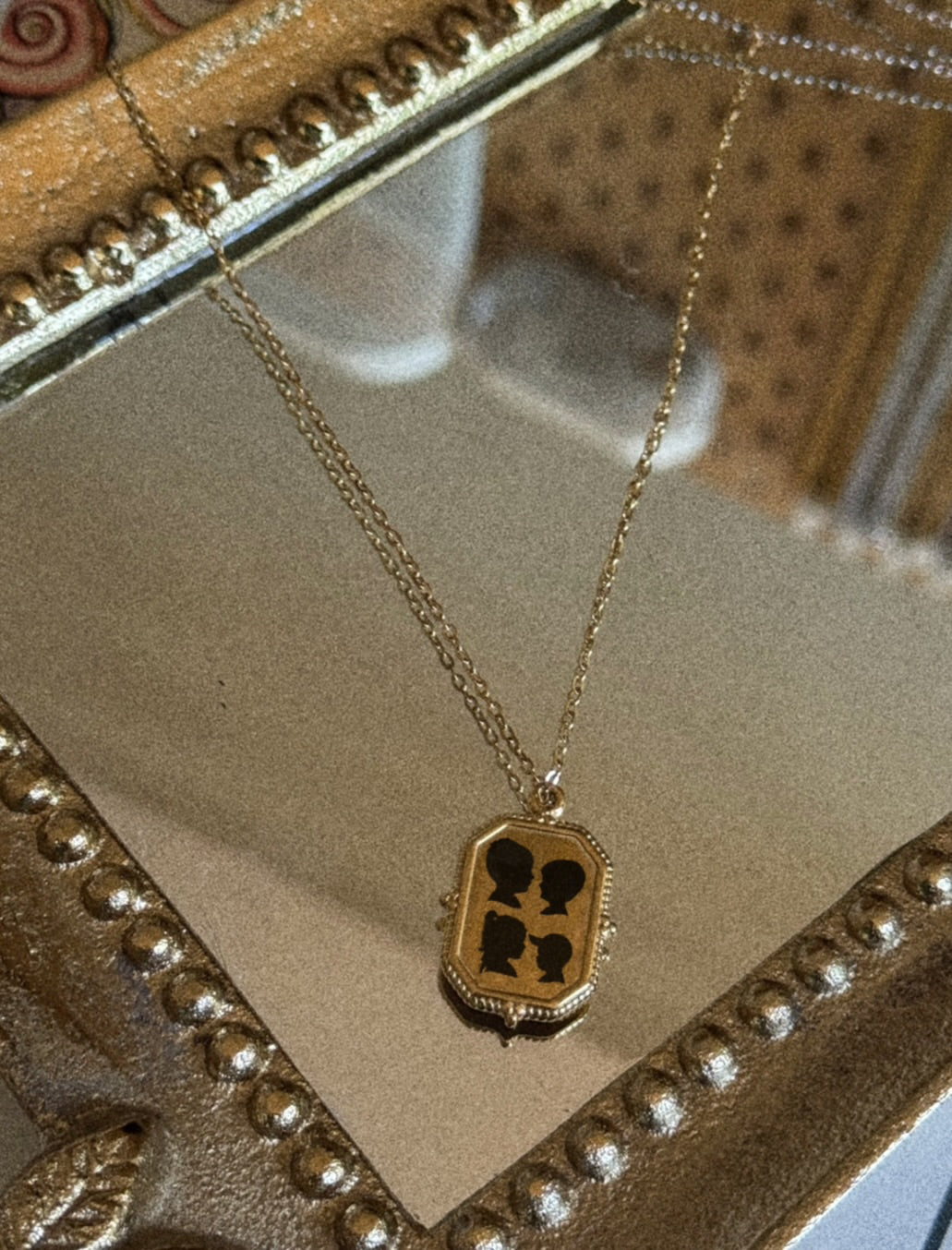 Framed charm silhouette necklace